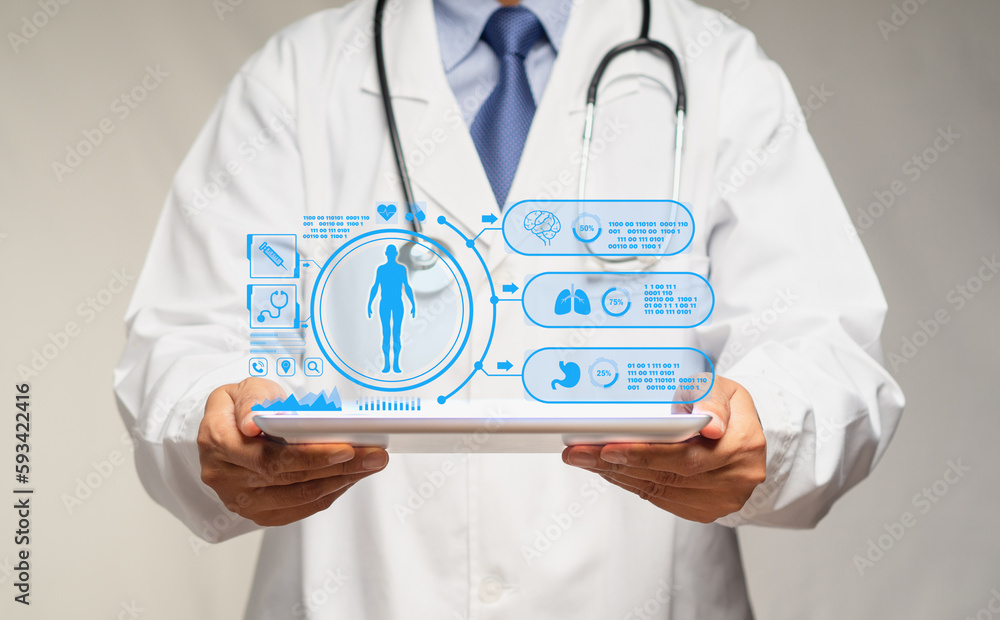 Doctor read a report health patient checkup on a virtual screen from a tablet while standing in the hospital Doctor read a report health patient checkup on a virtual screen from a tablet while standing in the hospital