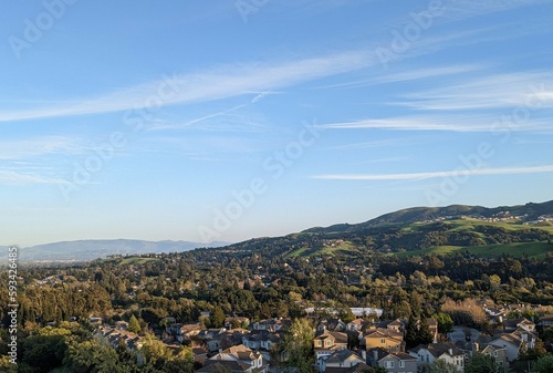 city of east San Francisco bay, San Ramon landscape with mountains and clouds, green hills visible in the foreground  San Francisco Bay Area, California  © Alina M. Darkhovsky 