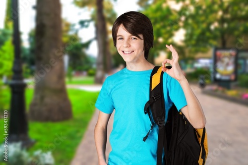 A happy smart child with a school bag