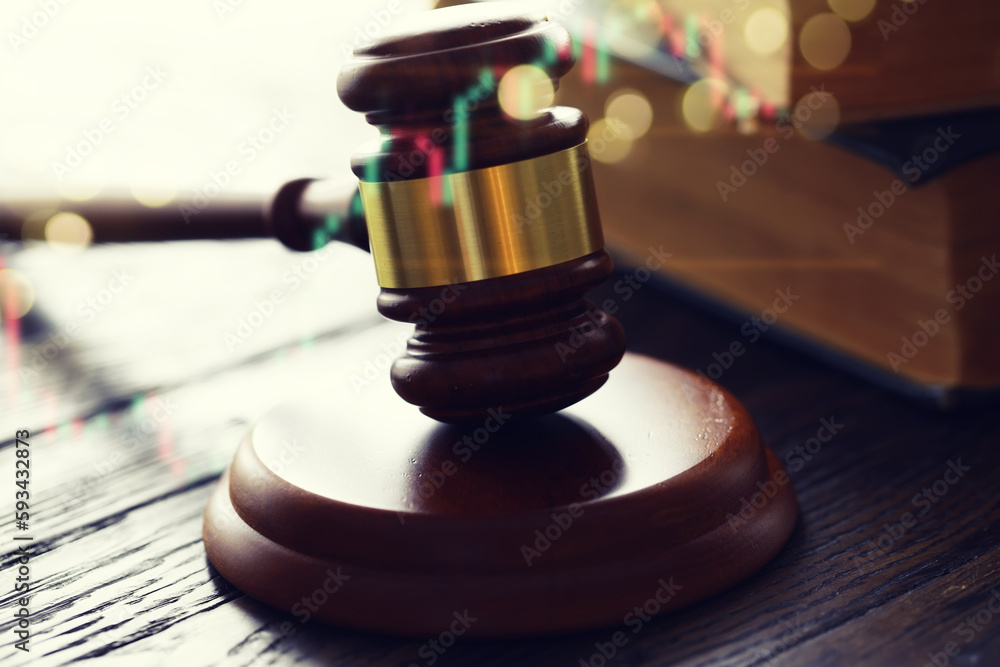 Wooden judge gavel and legal book on wooden table Wooden judge gavel and legal book on wooden table