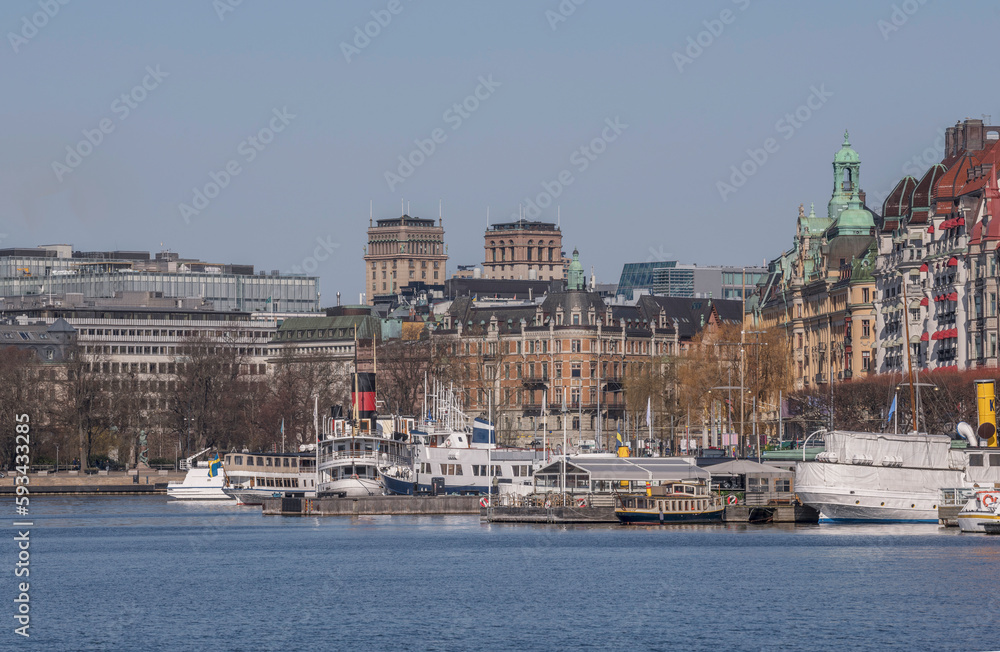 The bay Nybroviken with offices and archipelago commuting boats, a sunny day in Stockholm