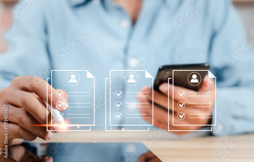 Human Resources (HR) management concept. Businessman filling out online employee appraisal form. Human resource management (HR), recruiting, leadership and team building.