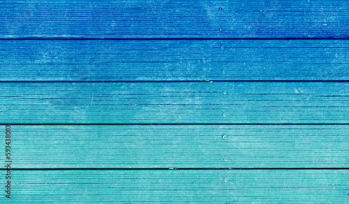 Painted wood deck floor texture background reminiscent of blue sky and mint emerald sea. There is blank empty space for copyspace and can be used for composing