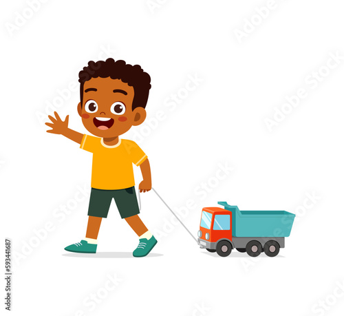 little kid playing a toy truck and feel happy