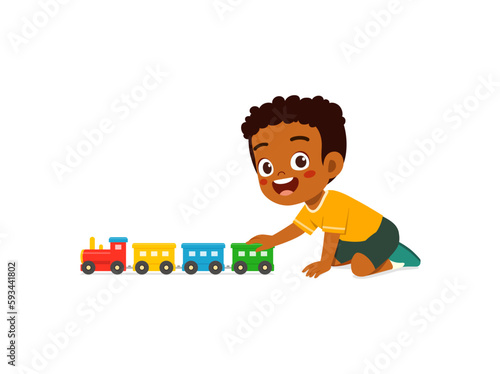 little kid playing toy train made from plastic and feel happy