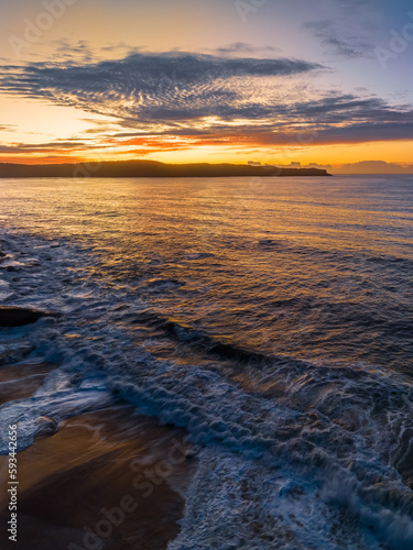 Aerial sunrise seascape with high cloud