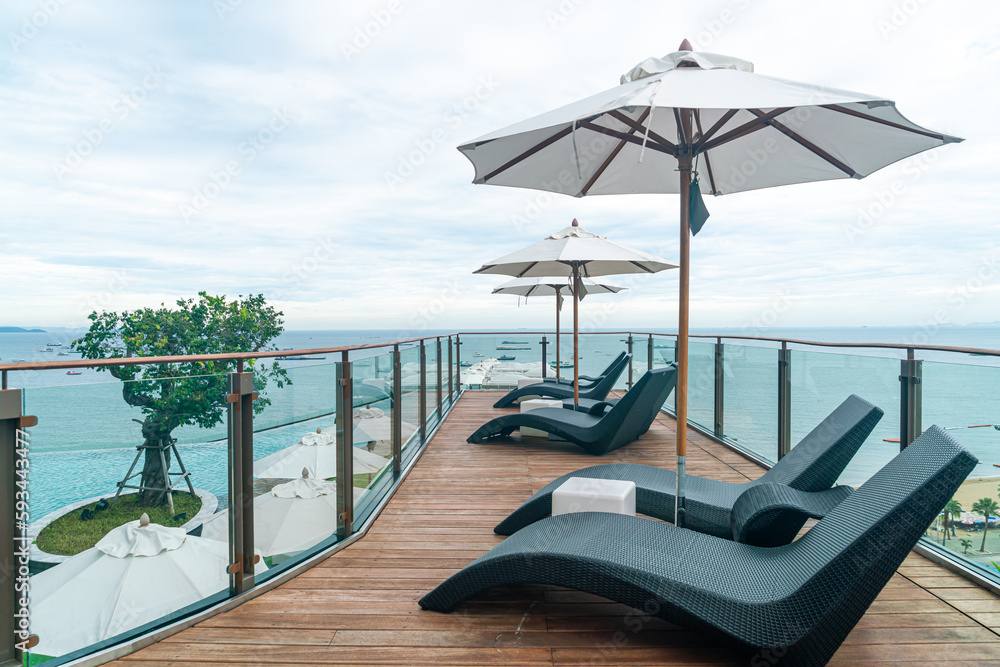 Fototapeta premium bed pool with umbrella around swimming pool