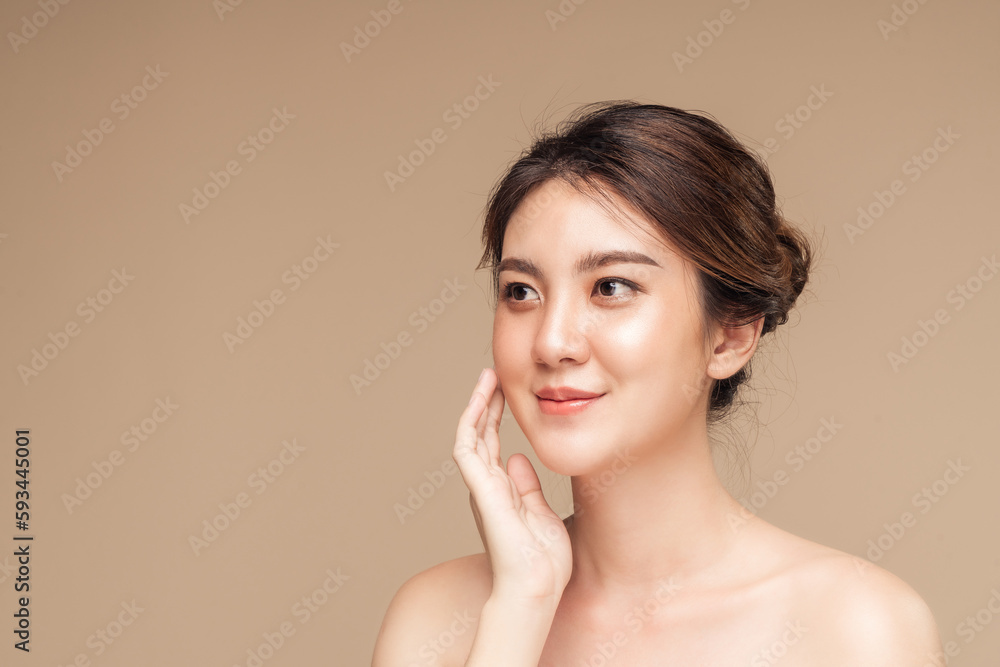 Closeup photo of a smiling brunette asian woman touching her face with natural makeup, hydrated skin, Closeup photo of a smiling brunette asian woman touching her face with natural makeup, hydrated skin,
