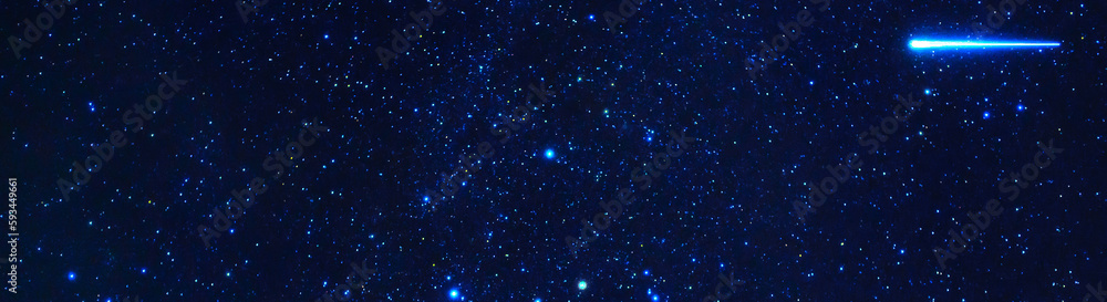 Stars on the background of the night starry sky with many constellations, universes and shooting stars. Panoramic wide horizontal photo for banner head cover