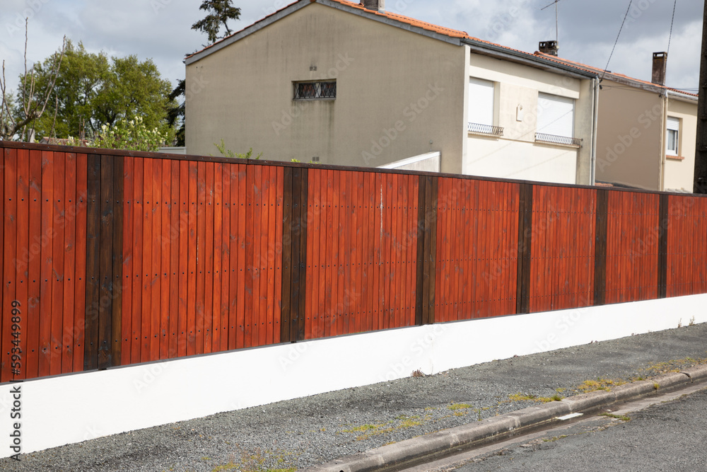brown wooden high fence private house suburb wood protect long visual protection barrier brown wooden high fence private house suburb wood protect long visual protection barrier
