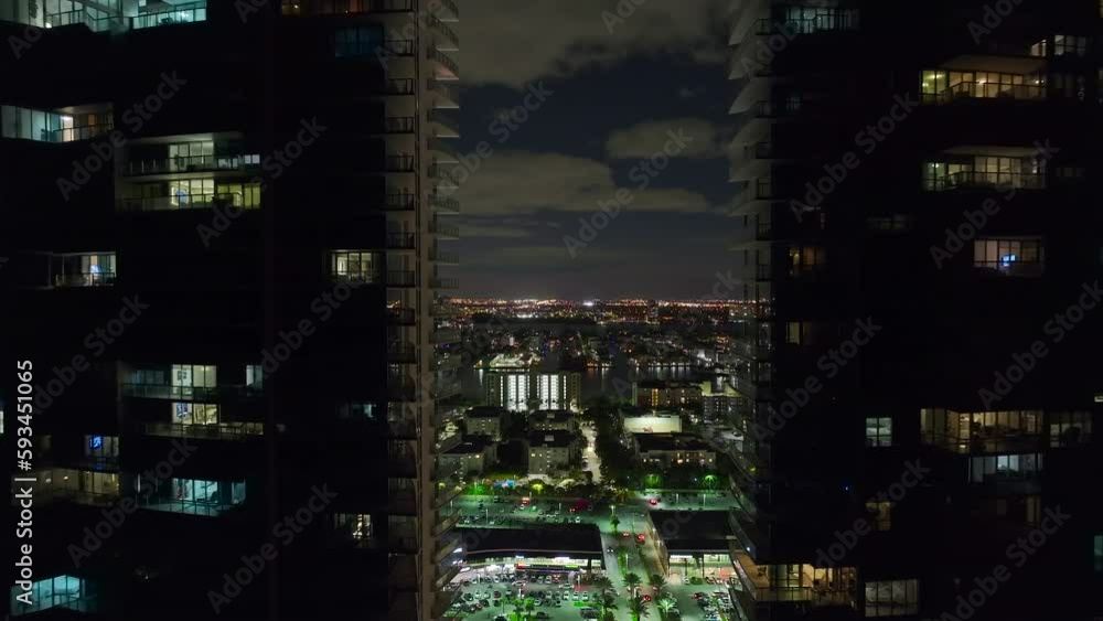Night urban landscape of downtown district in Sunny Isles Beach city in Florida, USA. Skyline with brightly illuminated high skyscraper buildings in modern american megapolis Night urban landscape of downtown district in Sunny Isles Beach city in Florida, USA. Skyline with brightly illuminated high skyscraper buildings in modern american megapolis