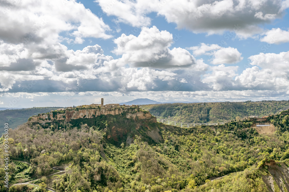 Obraz premium Panoramic view of Civita di Bagnoregio, Italy, as seen from Lubriano, under a dramatic sky