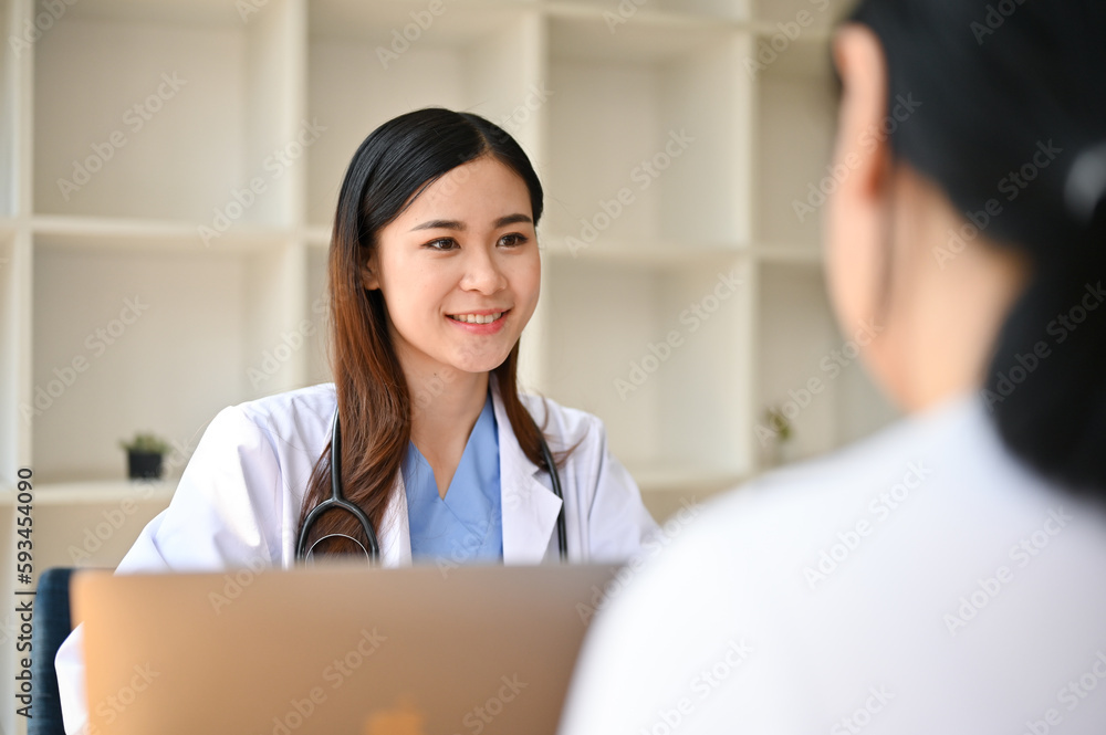 Professional Asian female doctor consults on a medical treatment plan with a patient Professional Asian female doctor consults on a medical treatment plan with a patient