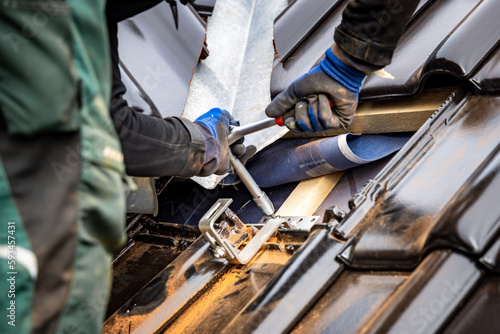 Canvas Print Fastening a bracket for a solar panel mounting system to a roof