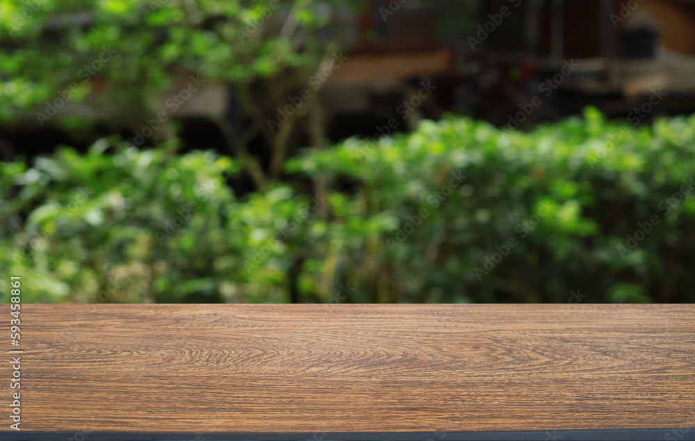Empty wooden table in front of abstract blurred background of coffee shop . can be used for display or montage your products.Mock up for display of product Empty wooden table in front of abstract blurred background of coffee shop . can be used for display or montage your products.Mock up for display of product