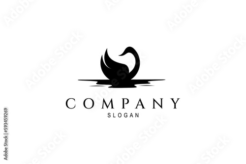 Vector logo in which an abstract image of a swan silhouette swimming in the water