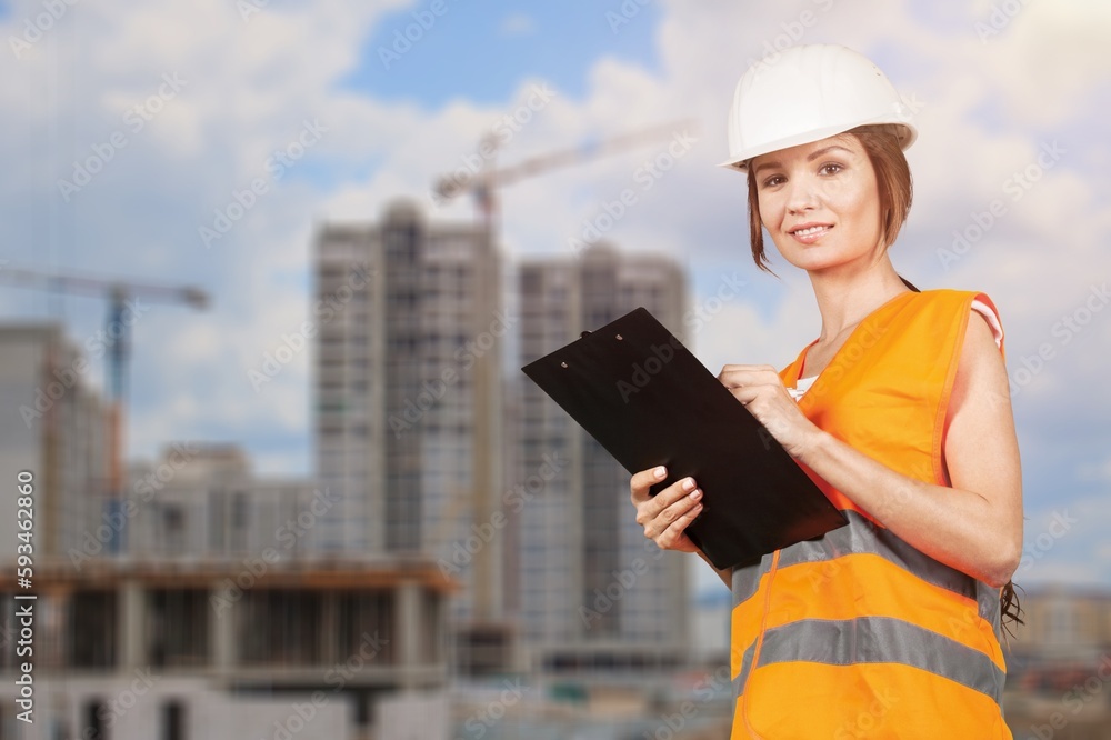Portrait of woman industry worker on factory warehouse background Portrait of woman industry worker on factory warehouse background