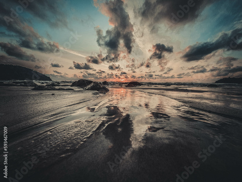 Sunrise at the beach with reflection © Radzuan