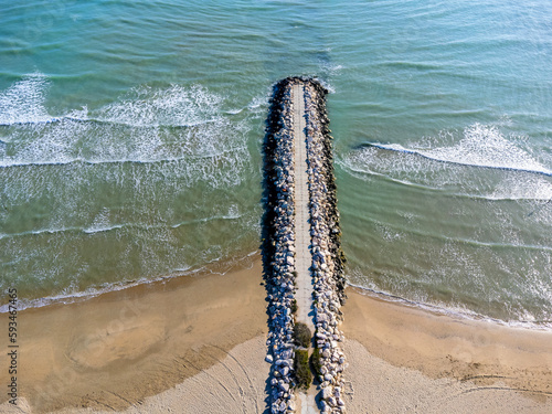 Aerial view landscape. Italy Pescara. Sea, waves, sand , empty beach, stones.