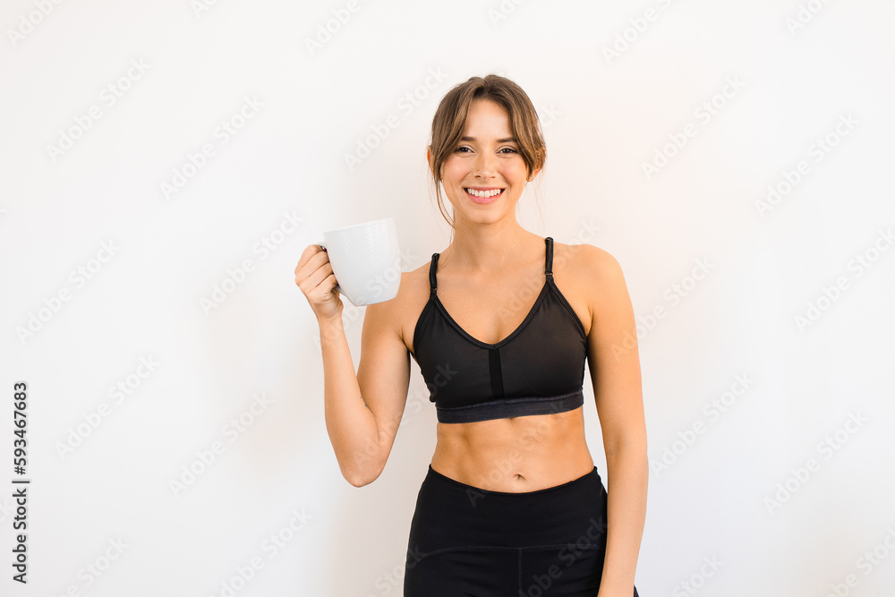 Sporty Woman Holding a Mug Drinking Tea Coffee Detox Healthy Lifestyle Sporty Woman Holding a Mug Drinking Tea Coffee Detox Healthy Lifestyle