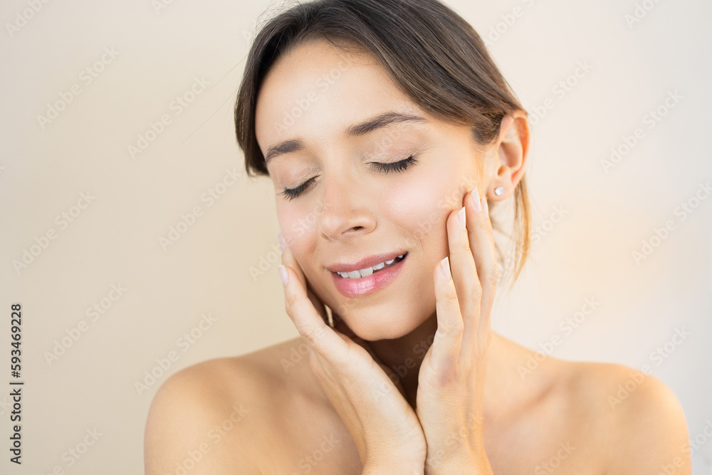 Young Woman With Glowy Skin Eyes Closed Touching her Face with Flawless Healthy and Bright No-Makeup Makeup Look Young Woman With Glowy Skin Eyes Closed Touching her Face with Flawless Healthy and Bright No-Makeup Makeup Look