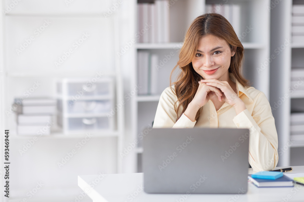 Asian Business woman using calculator and laptop for doing math finance on an office desk, tax, report, accounting, statistics, and analytical research concept
Asian Business woman using calculator and laptop for doing math finance on an office desk, tax, report, accounting, statistics, and analytical research concept