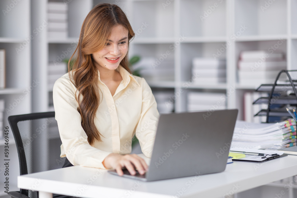 Asian Business woman using calculator and laptop for doing math finance on an office desk, tax, report, accounting, statistics, and analytical research concept
Asian Business woman using calculator and laptop for doing math finance on an office desk, tax, report, accounting, statistics, and analytical research concept