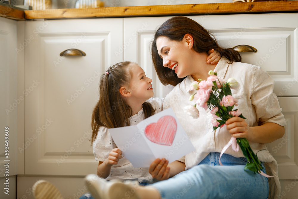 Daughter giving mother bouquet of flowers. Daughter giving mother bouquet of flowers.