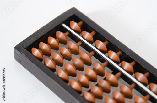Old brown abacus on white background.