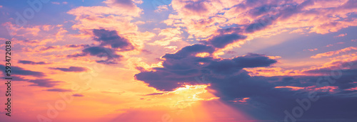 Colorful cloudy sky in the evening. Sunset with the beautiful blazing sky