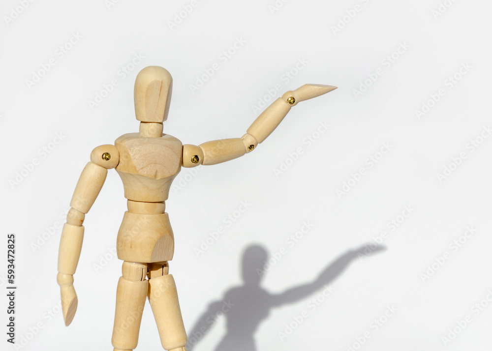 Wooden man on white background shows space for copy and text Wooden man on white background shows space for copy and text