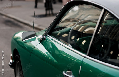 classic green car.