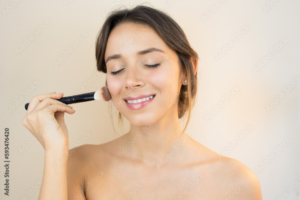 Woman Applying Makeup with Makeup Brush and a No-Makeup Makeup Look with Glowy and Healthy Skin Perfect Complexion Blush Contouring Woman Applying Makeup with Makeup Brush and a No-Makeup Makeup Look with Glowy and Healthy Skin Perfect Complexion Blush Contouring