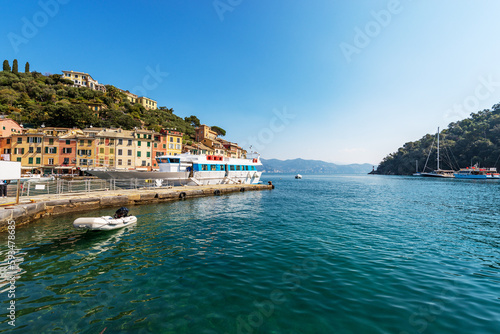 Fototapeta Naklejka Na Ścianę i Meble -  Famous village of Portofino, luxury tourist resort in Genoa Province, Liguria, Italy, Europe. Port and colorful houses, Mediterranean sea (Ligurian sea).