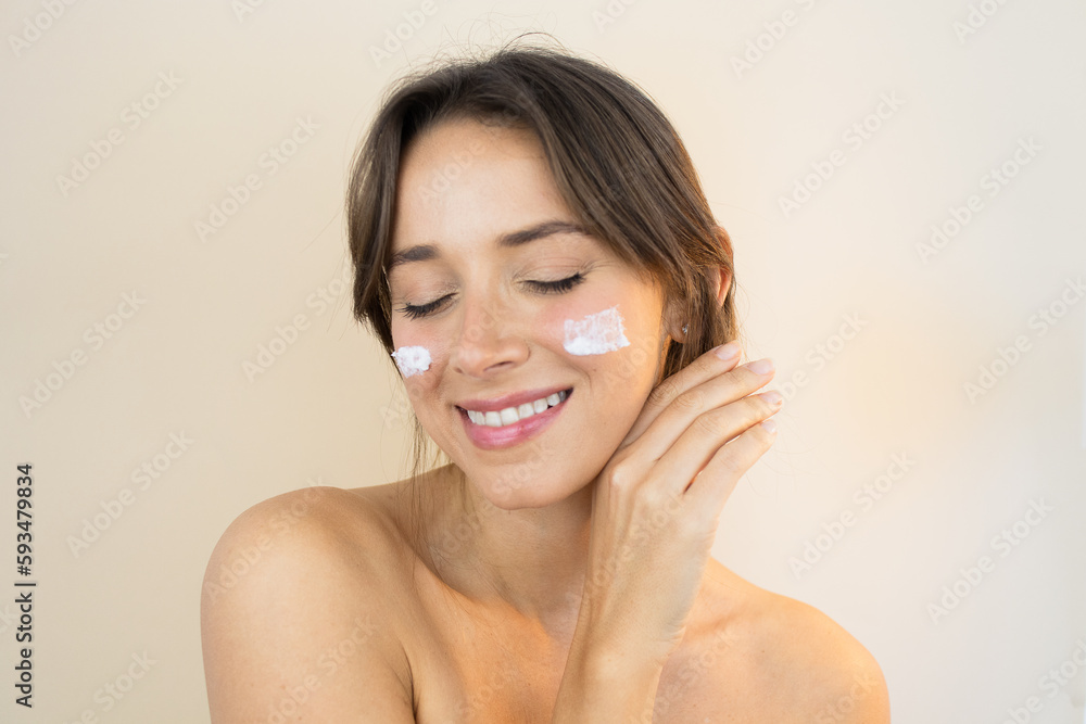 Young Woman With Face Cream Moisturizer with Glowing Skin Plump and Smooth Skin Looking Healthy with Clean Complexion and Blemish Free With Eyes Closed