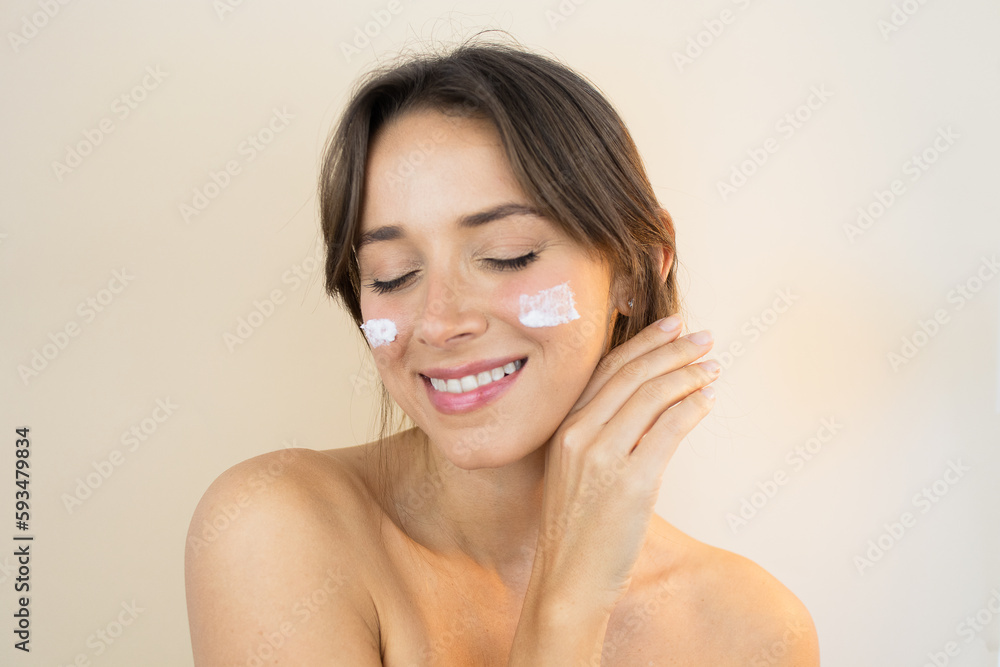 Young Woman With Face Cream Moisturizer with Glowing Skin Plump and Smooth Skin Looking Healthy with Clean Complexion and Blemish Free With Eyes Closed Young Woman With Face Cream Moisturizer with Glowing Skin Plump and Smooth Skin Looking Healthy with Clean Complexion and Blemish Free With Eyes Closed