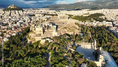 Aerial drone cinematic video of amazing Acropolis hill, the Parthenon and Propylaea entrance above Areopagus hill, a masterpiece of ancient world, Athens historic centre, Attica, Greece photo