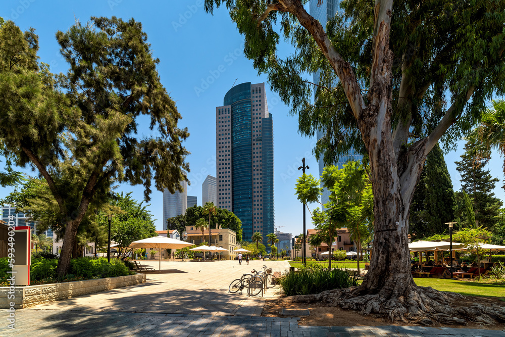 Urban park and modern buildings under blue sky in Tel Aviv, Israel. Urban park and modern buildings under blue sky in Tel Aviv, Israel.