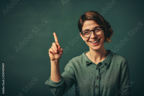 Educational Excellence: Smiling teacher pointing to chalkboard on isolated grey background with space for text. Copy space. Learning concept AI Generative