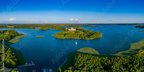 Drone aerial landscape photo - Camaldolese monastery complex and Wigry Lake, national park - summer in Poland