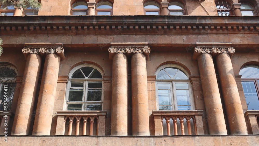 Close up front view of the old building in Yerevan concept photo. Urban architectural photography.