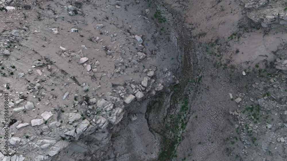Aerial view looking down over rocky waterless drought gorge of Sau reservoir, Catalonia, Spain