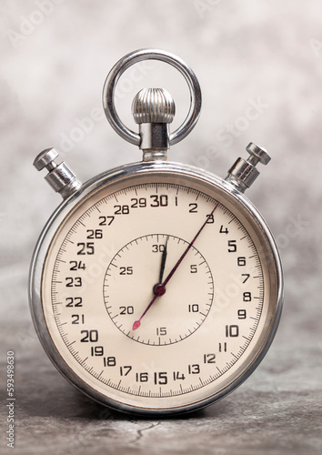 Old stopwatch on a gray background