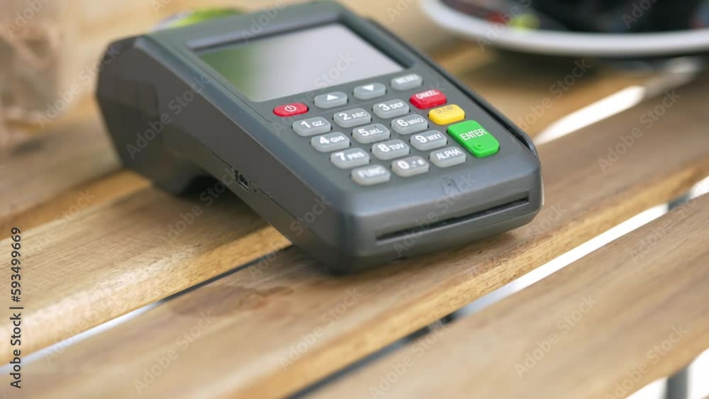 Terminal for card payments. A bank card is attached.