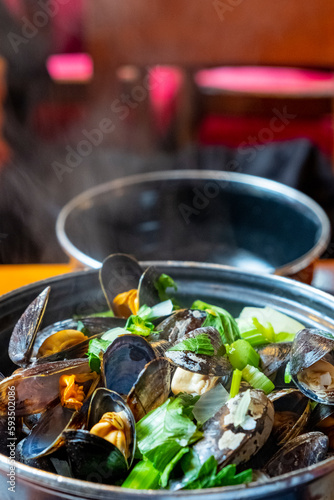A closeup of a delicious steamed mussel casserole in a Belgian restaurant.