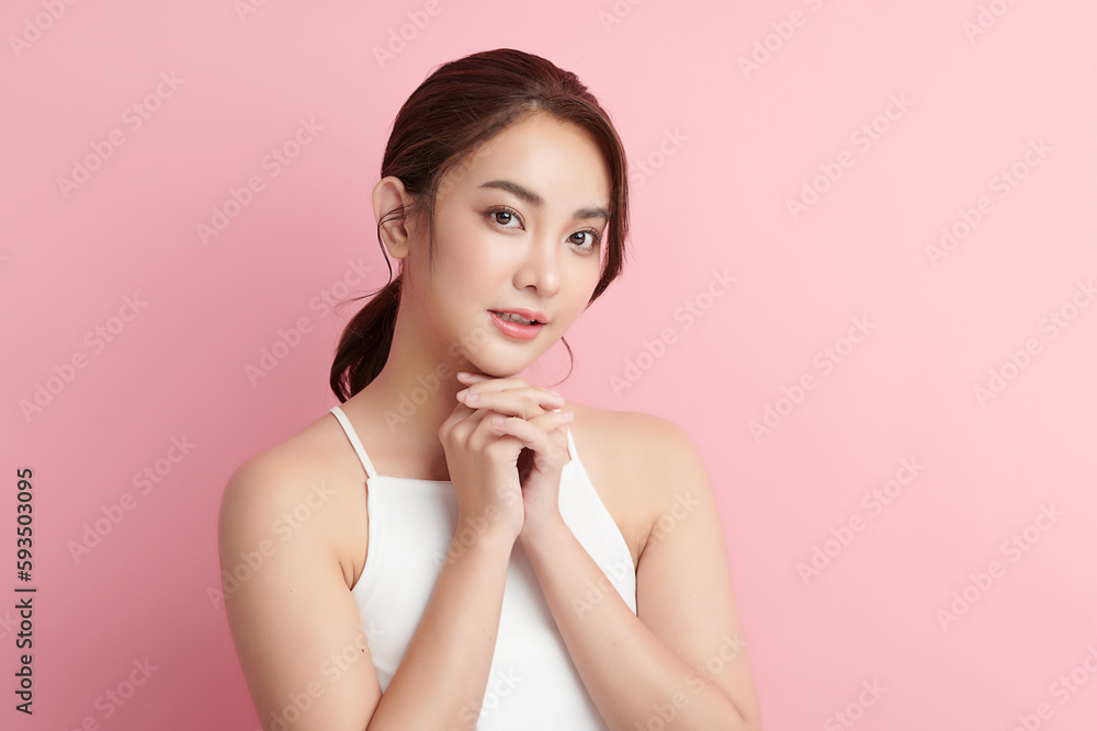 Beautiful young asian woman with clean fresh skin on pink background, Face care, Facial treatment, Cosmetology, beauty and spa, Asian women portrait. Beautiful young asian woman with clean fresh skin on pink background, Face care, Facial treatment, Cosmetology, beauty and spa, Asian women portrait.
