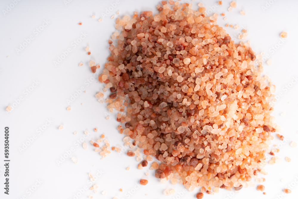 Himalayan pink salt isolated on white background with copyspace Himalayan pink salt isolated on white background with copyspace