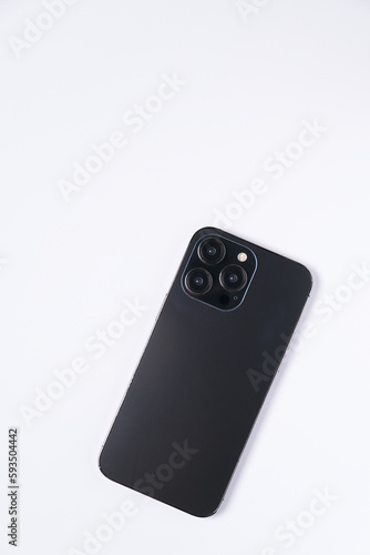 Black smartphone with three lenses isolated on white background. copy space for font.