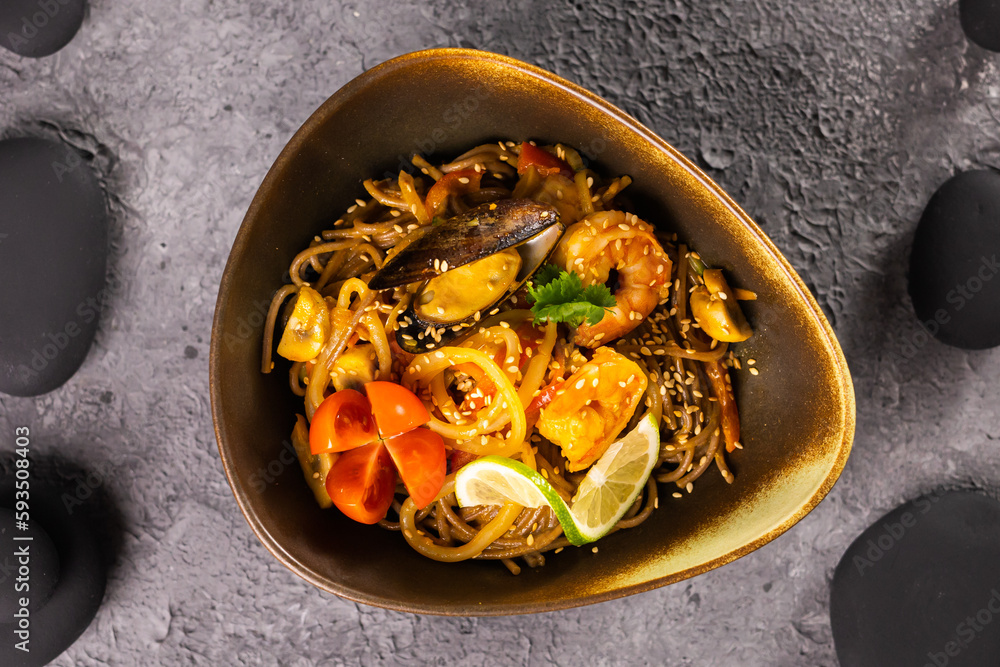 Udon stir-fry noodles with mussels and shrimp. Asian cuisine Udon stir-fry noodles with mussels and shrimp. Asian cuisine