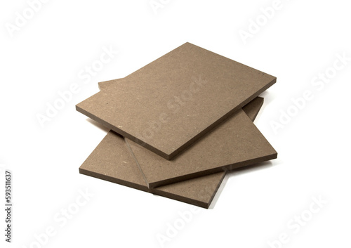 Three boards of raw mdf brown color stand on top of each other.